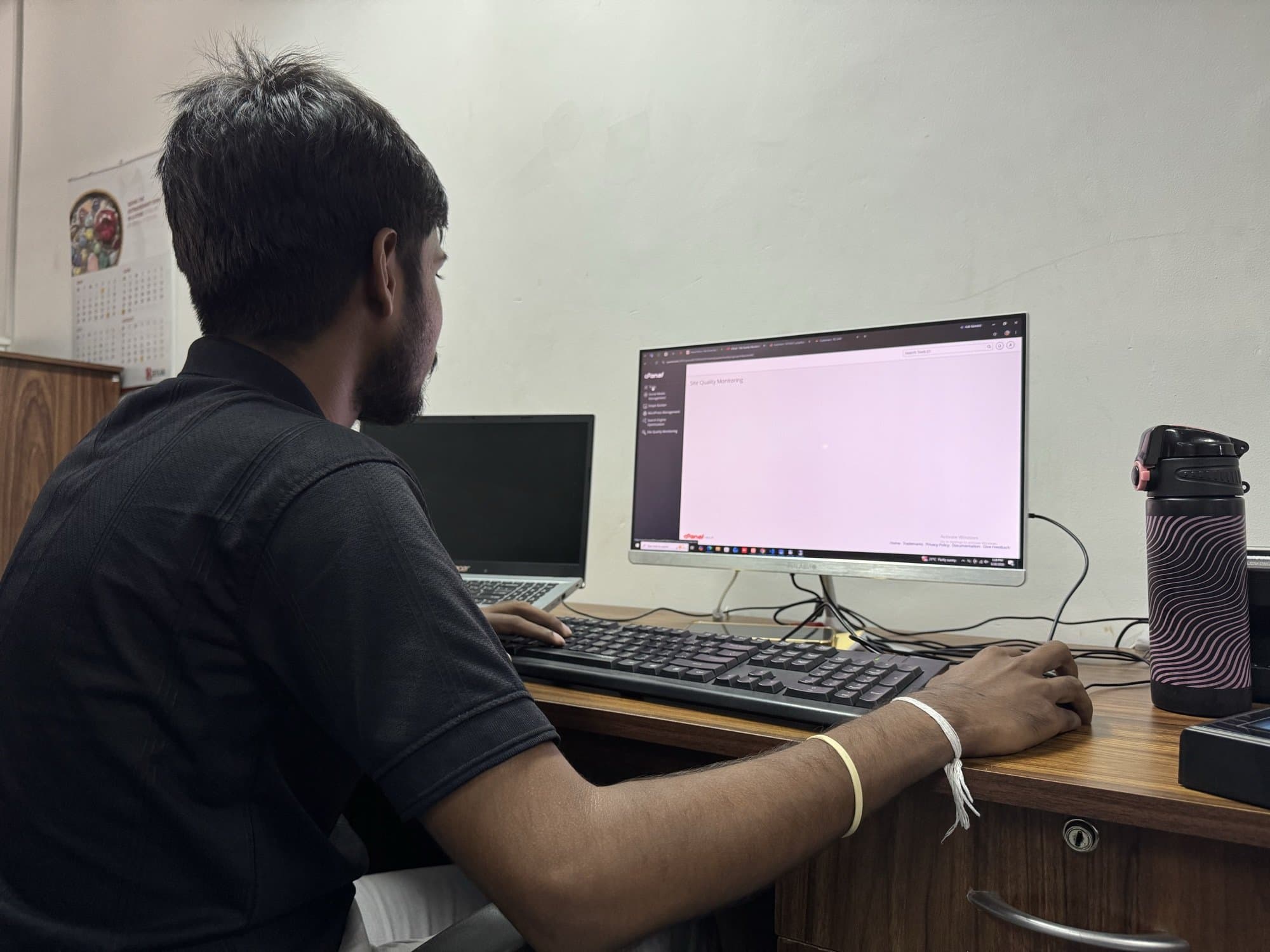 A Synco team member configuring a client site in the Colombo office